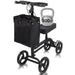 Black knee walker with a bag and a 300 lb kettlebell on a white background