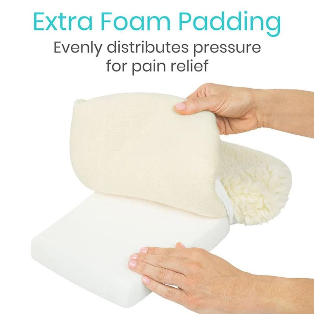 Hand holding a cylindrical pillow with extra foam padding, text indicating pressure relief.