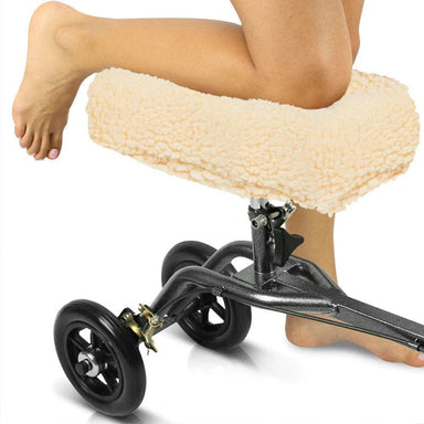 Person using a knee scooter with a fluffy cover on a white background
