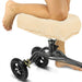 Person using a knee scooter with a fluffy cover on a white background