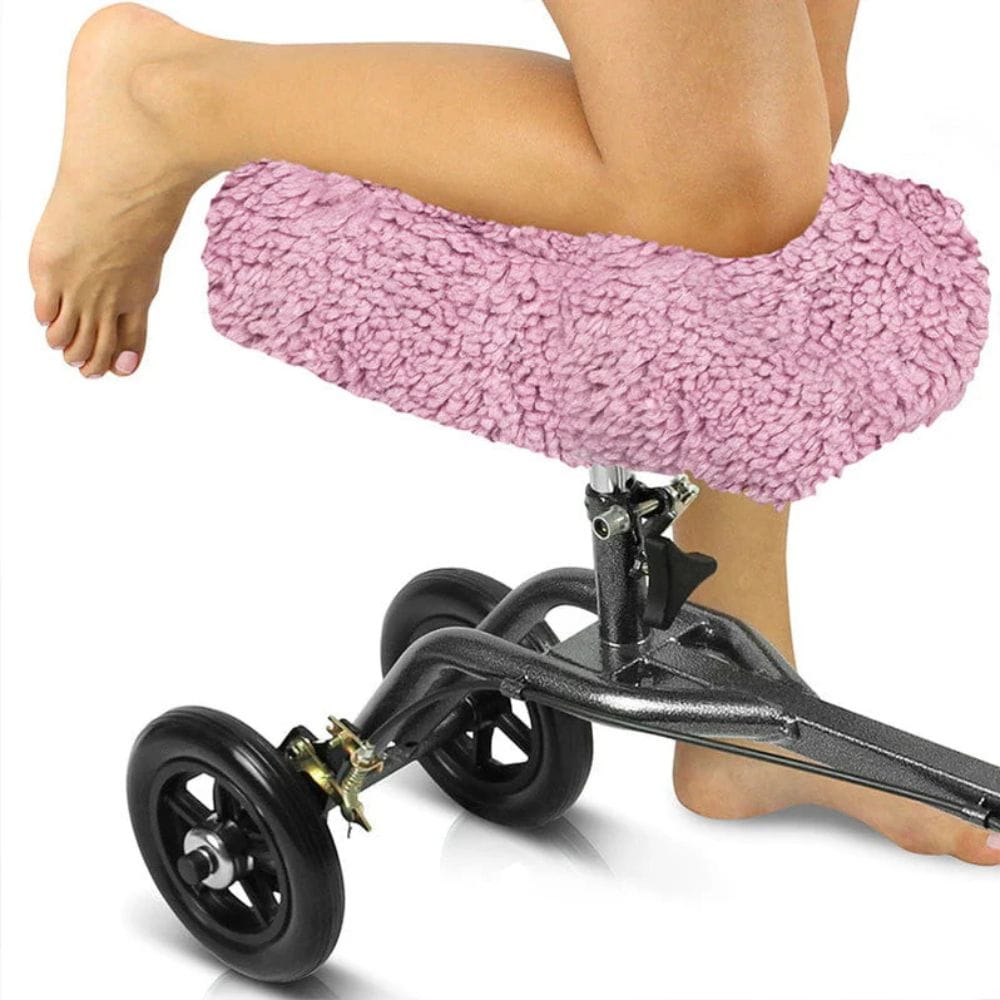 Pink knee pillow with wheels on a white background