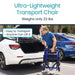 Man using an ultra-lightweight transport chair next to a car with text highlighting its weight and ease of use.