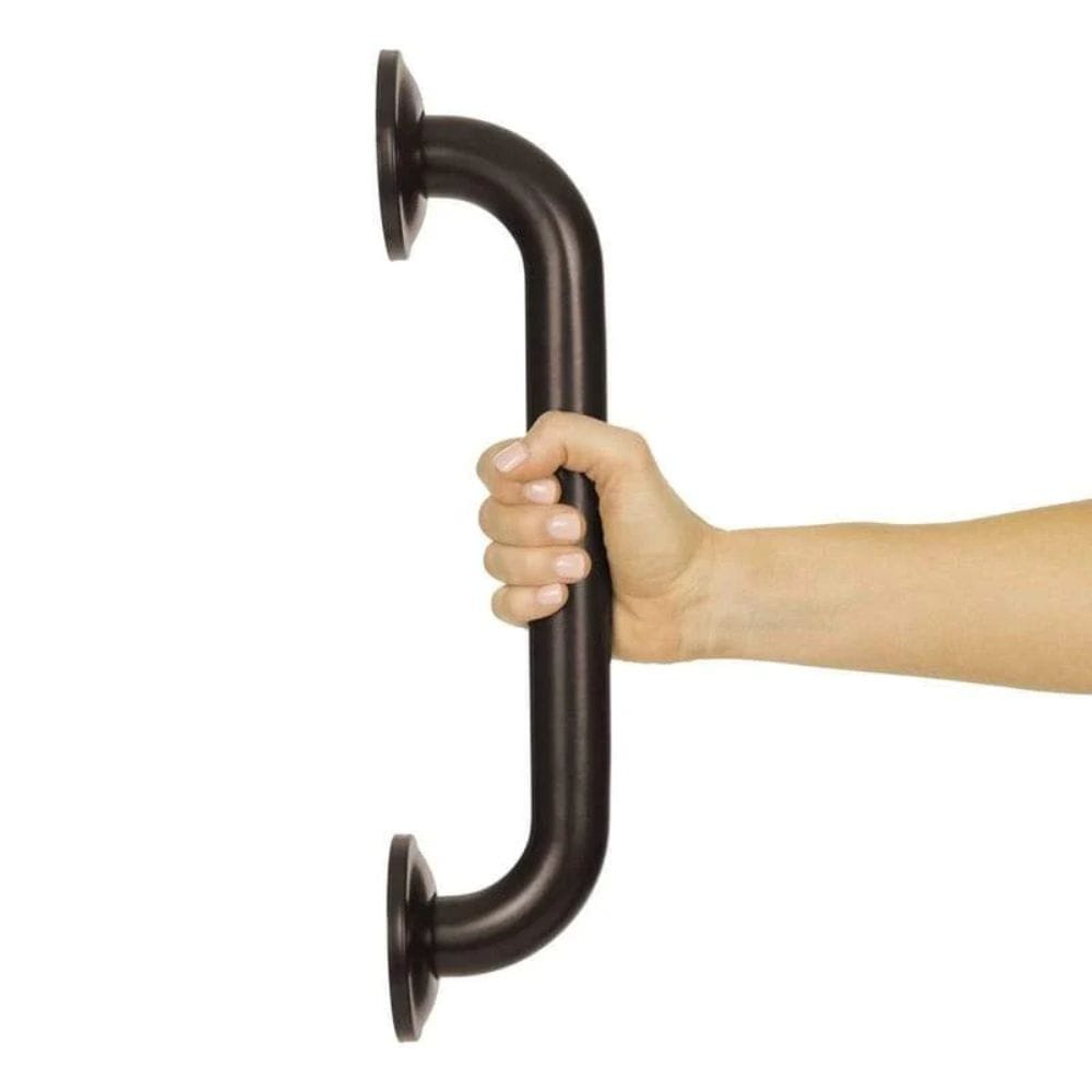 Hand holding a dark metal grab bar against a white background
