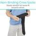 Person holding a black non-binding crew sock with text about elastic stretch for loose fit around calves.