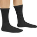 Black socks worn by a person on a white background