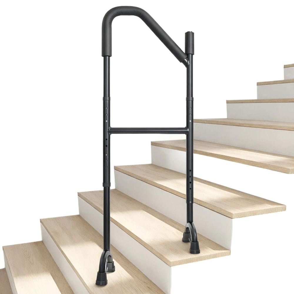 Black metal stair rail on a set of wooden stairs with a white background