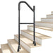 Black metal stair rail on a set of wooden stairs with a white background