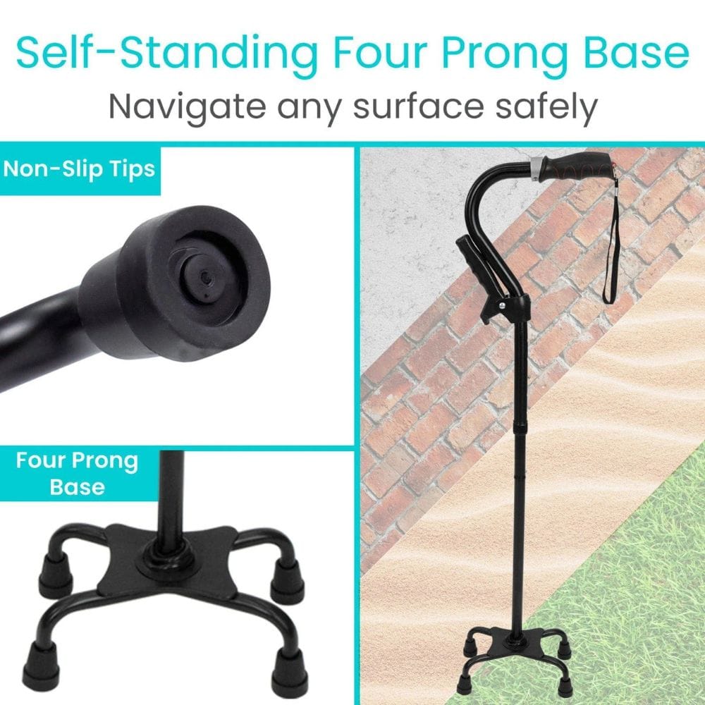 Black walking cane with four prong base and non-slip tips on a textured surface.