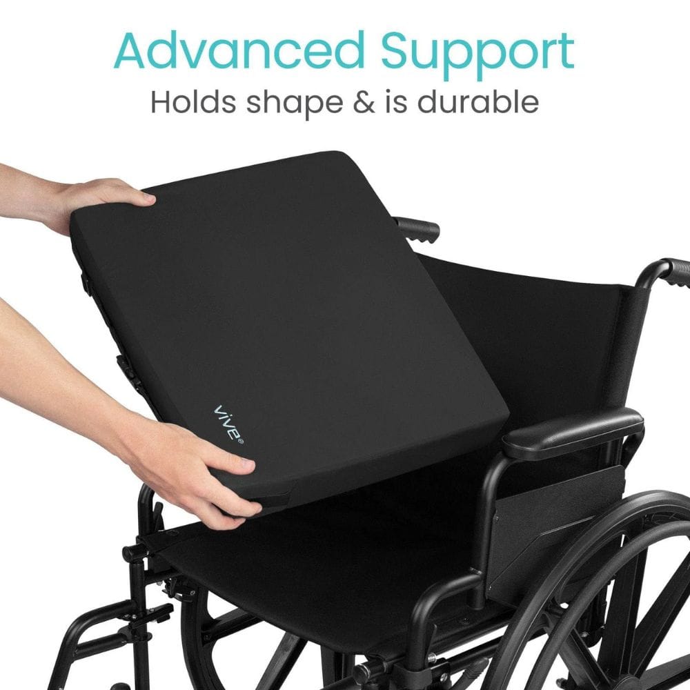 Black wheelchair cushion being held above a wheelchair with text 'Advanced Support Holds shape & is durable'.