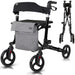 Black and gray rollator with a seat and bag on a white background