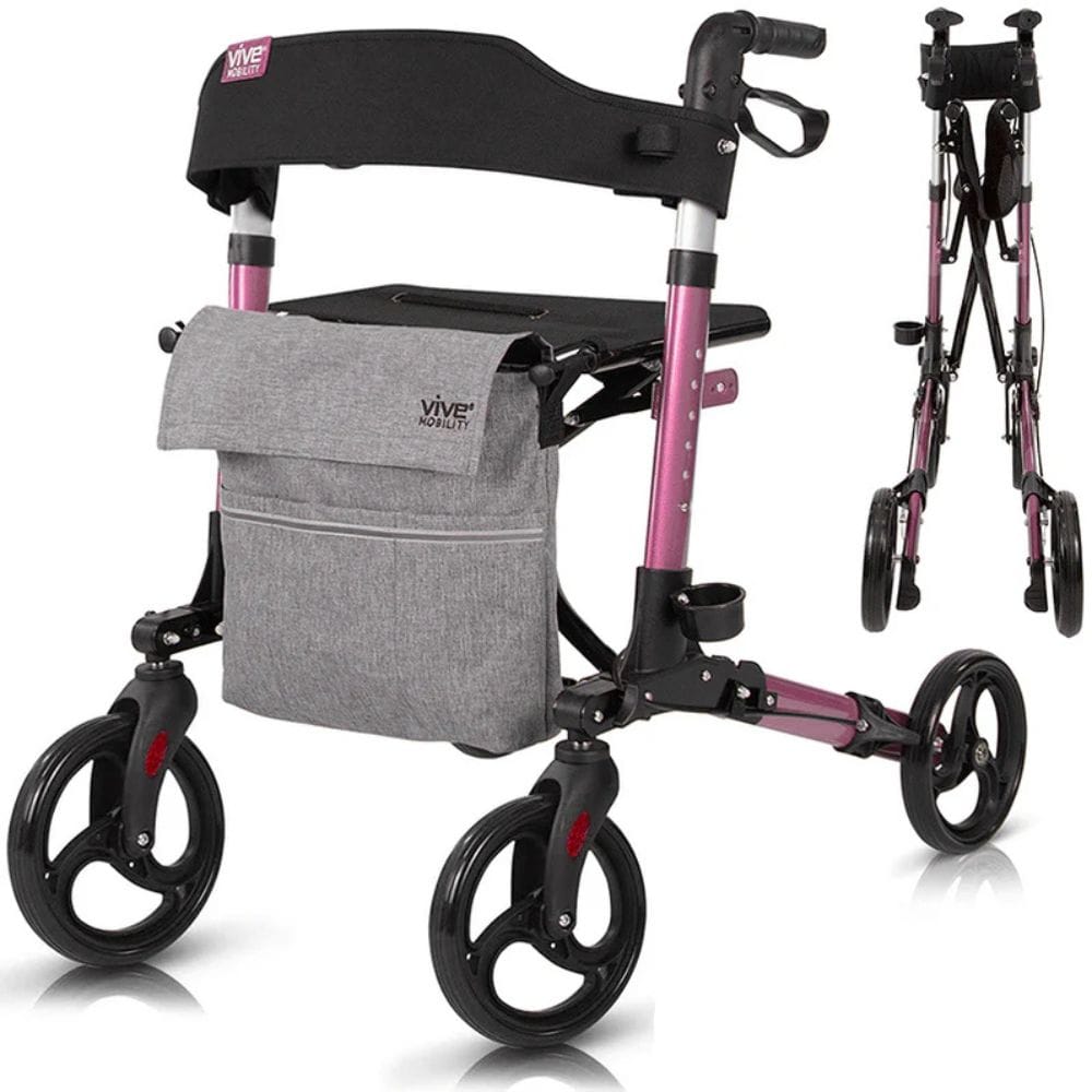 Pink and black rollator with gray bag on a white background