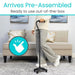 Person using a standing vacuum cleaner in a living room setting with text indicating it arrives pre-assembled.