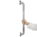 Stainless steel grab bar held by a hand on a white background