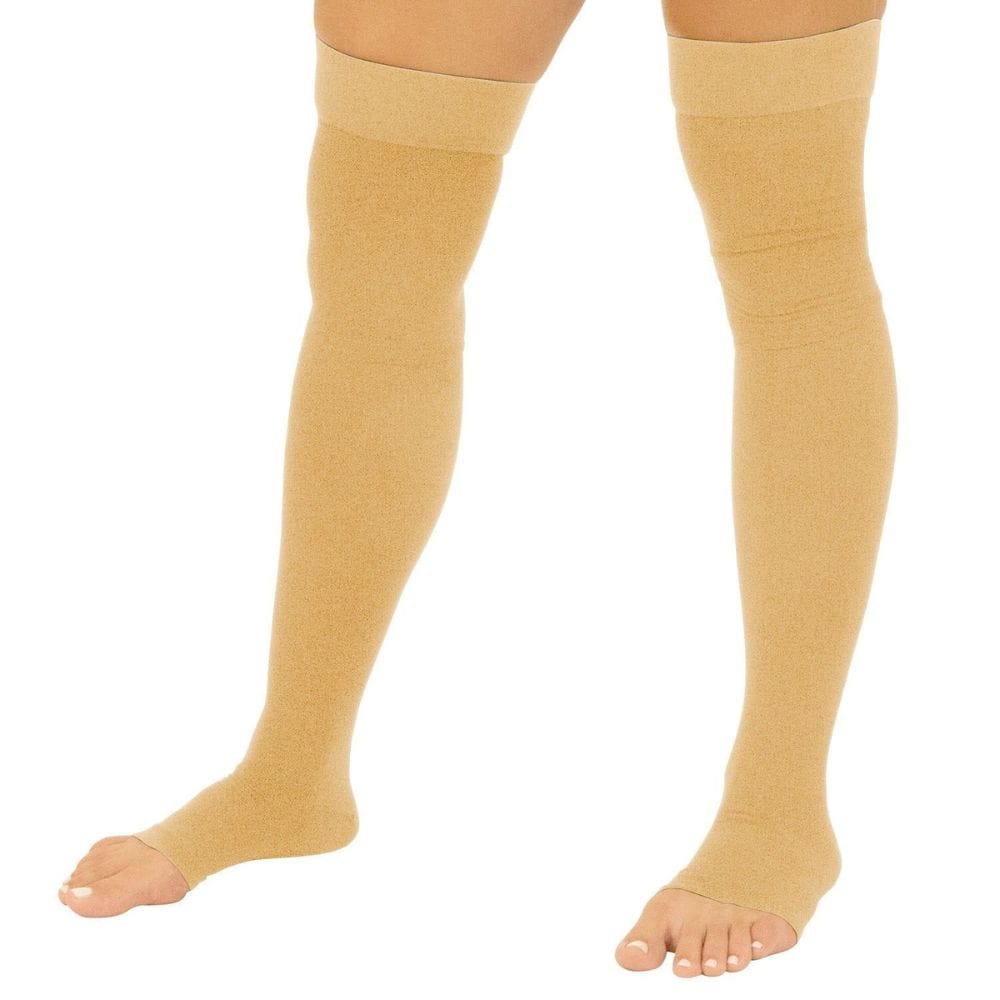 Beige knee-high socks worn by a person on a white background