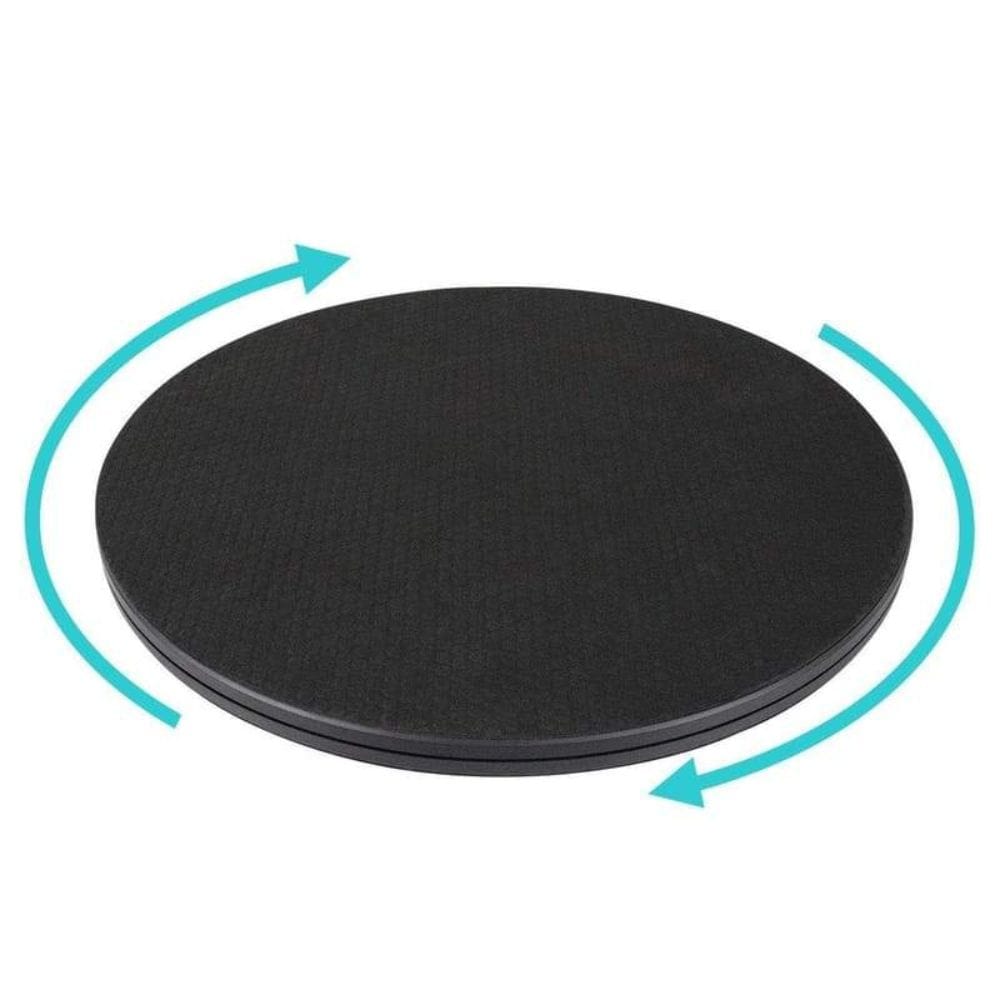 Black round mat with blue arrows indicating rotation on a white background