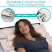 Woman lying on a massage table with text about durable construction and easy connection of air hoses.