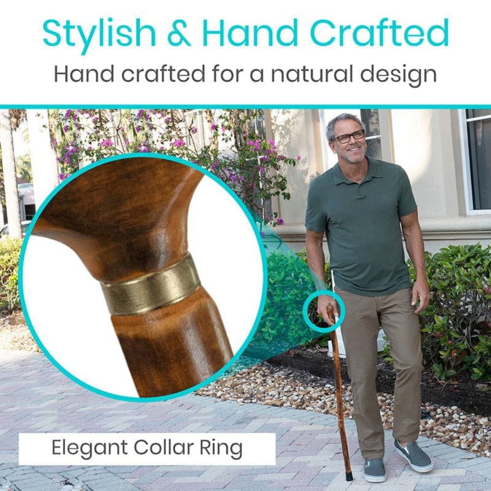 Man holding a walking cane with an elegant collar ring, surrounded by nature.