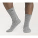 Gray socks worn by a person on a white background