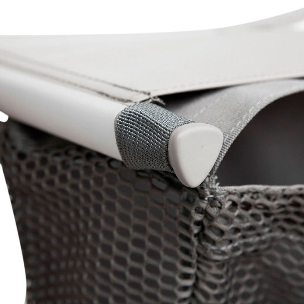 Close-up of a textured gray handle on a product with a white background