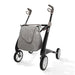 Gray stroller with a bag on a white background