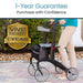 Person using a walker with Vive Health 1-Year Guarantee badge in the background