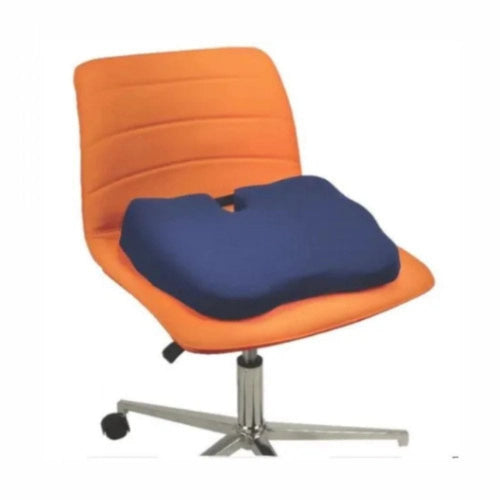 An ergonomic office chair with an orange upholstered seat and backrest, fitted with a contoured navy blue lumbar support cushion on a chrome five-star wheeled base.